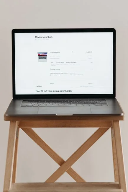 Portable computer with website representing assorted abstract photos under favorites and browser search engine with magnifier symbol
